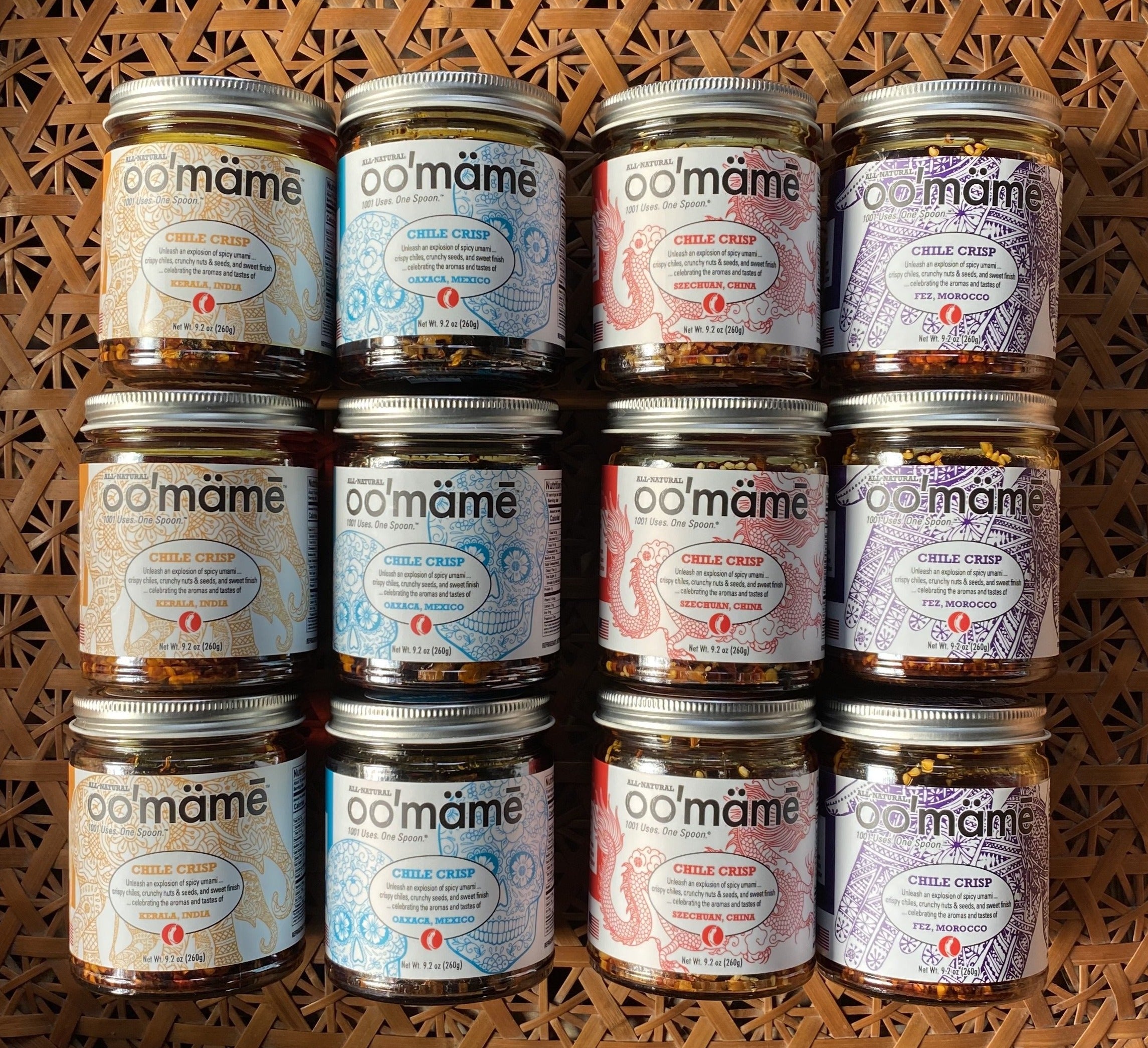oo'mämē Chili Crisp, 4 flavors presented in Wicker Basket Background